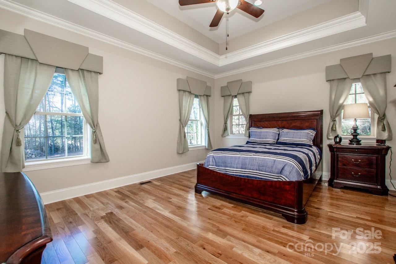 570 Morrison Farm Road Troutman, NC 28166 - Photo 14 of 32 a bedroom with a bed and window