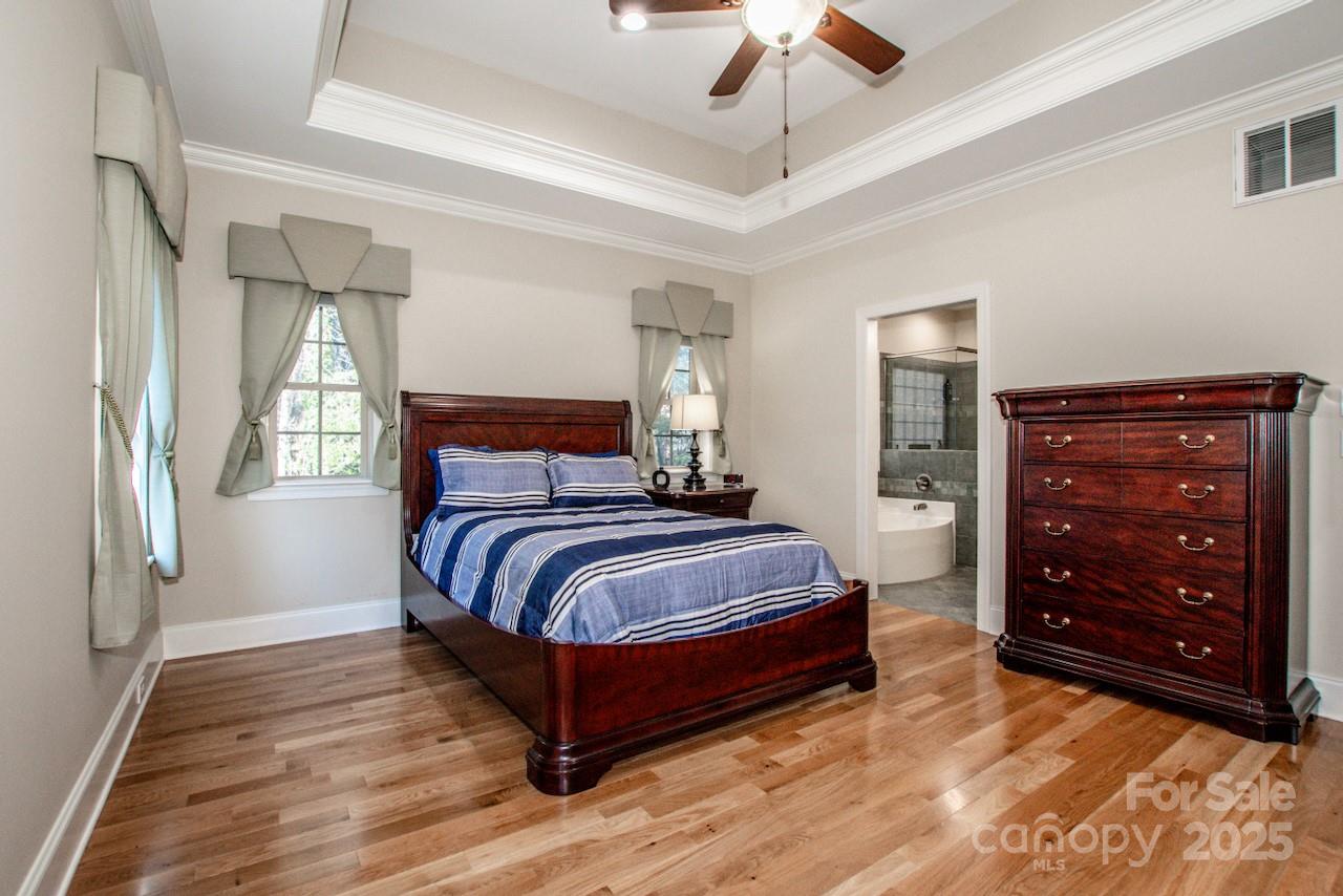 570 Morrison Farm Road Troutman, NC 28166 - Photo 15 of 32 a bedroom with a bed and a dresser