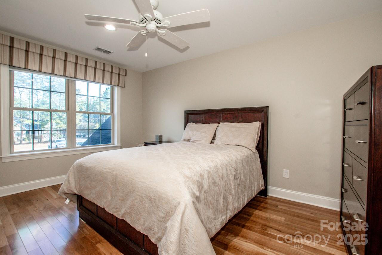 570 Morrison Farm Road Troutman, NC 28166 - Photo 20 of 32 a large bed sitting in a bedroom next to a window