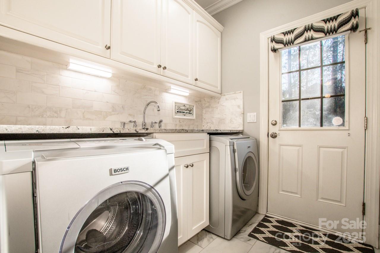 570 Morrison Farm Road Troutman, NC 28166 - Photo 26 of 32 a utility room with dryer and washer