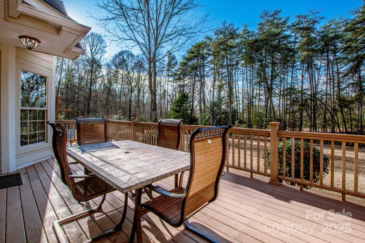 570 Morrison Farm Road Troutman, NC 28166 - Photo 32 of 32 a view of a dinning table and chairs on roof deck