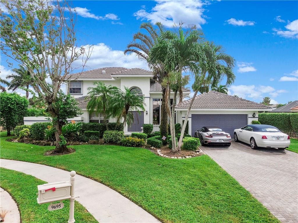 9695 West Lake Court Boca Raton, FL 33434 - Photo 1 of 43 a view of a car park in front of house