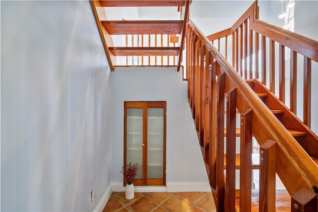 9695 West Lake Court Boca Raton, FL 33434 - Photo 18 of 43 a view of staircase with railing and a window