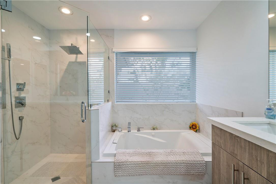 9695 West Lake Court Boca Raton, FL 33434 - Photo 22 of 43 a bathroom with a bathtub and a sink