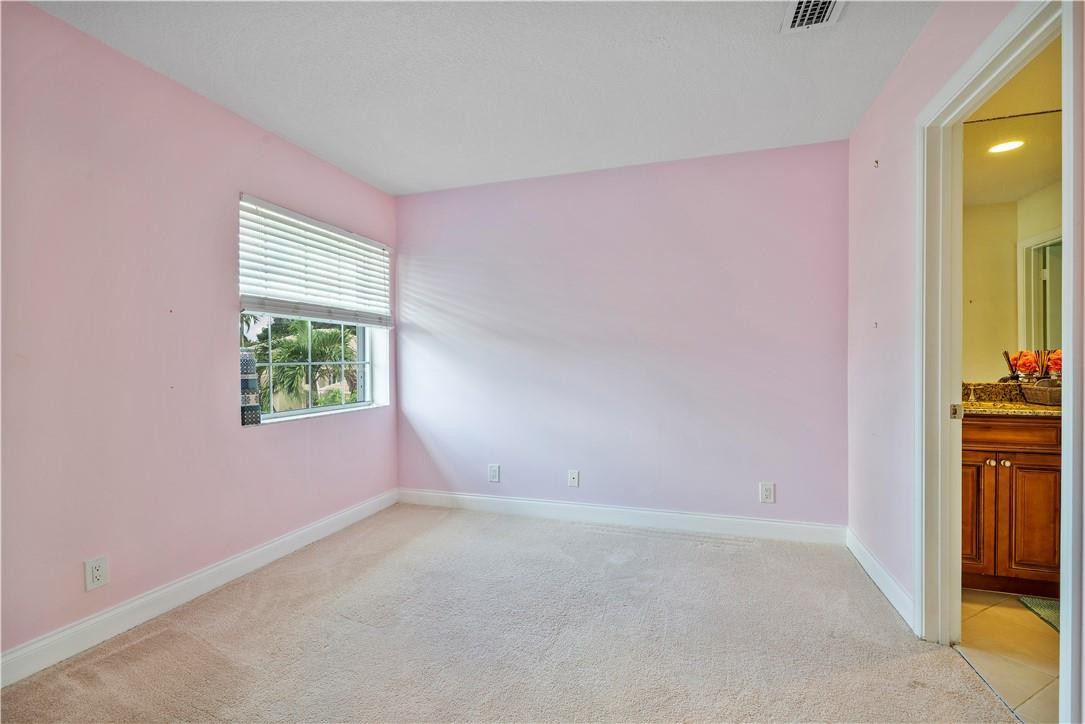 9695 West Lake Court Boca Raton, FL 33434 - Photo 24 of 43 an empty room with windows