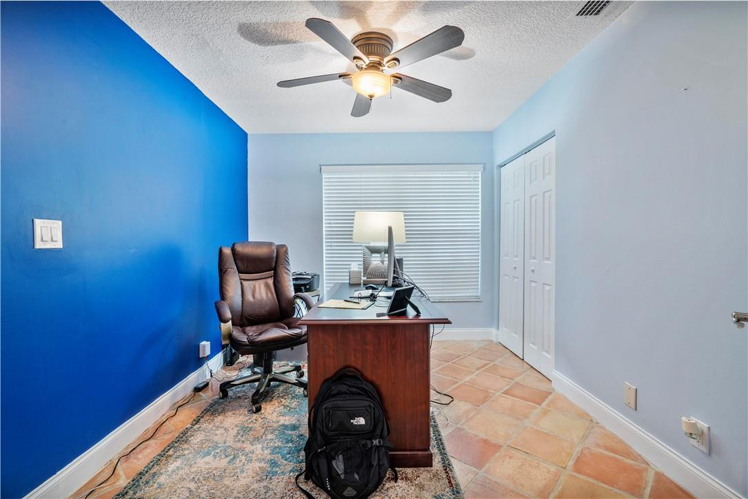 9695 West Lake Court Boca Raton, FL 33434 - Photo 25 of 43 a workspace with furniture and chandelier