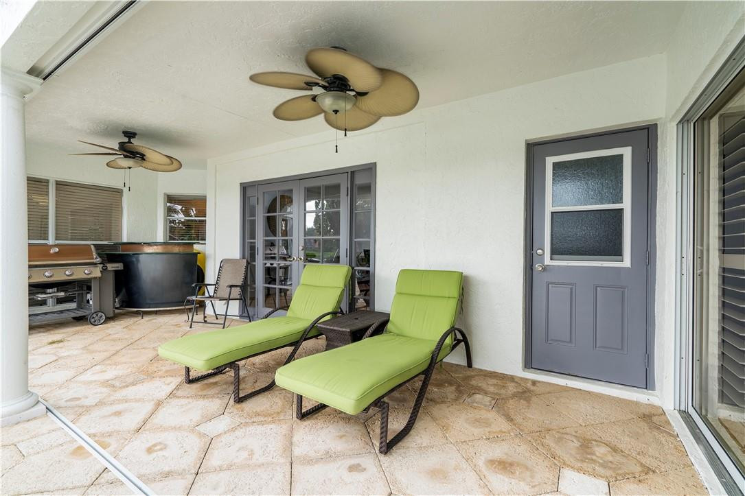 9695 West Lake Court Boca Raton, FL 33434 - Photo 28 of 43 a living room with furniture and a flat screen tv