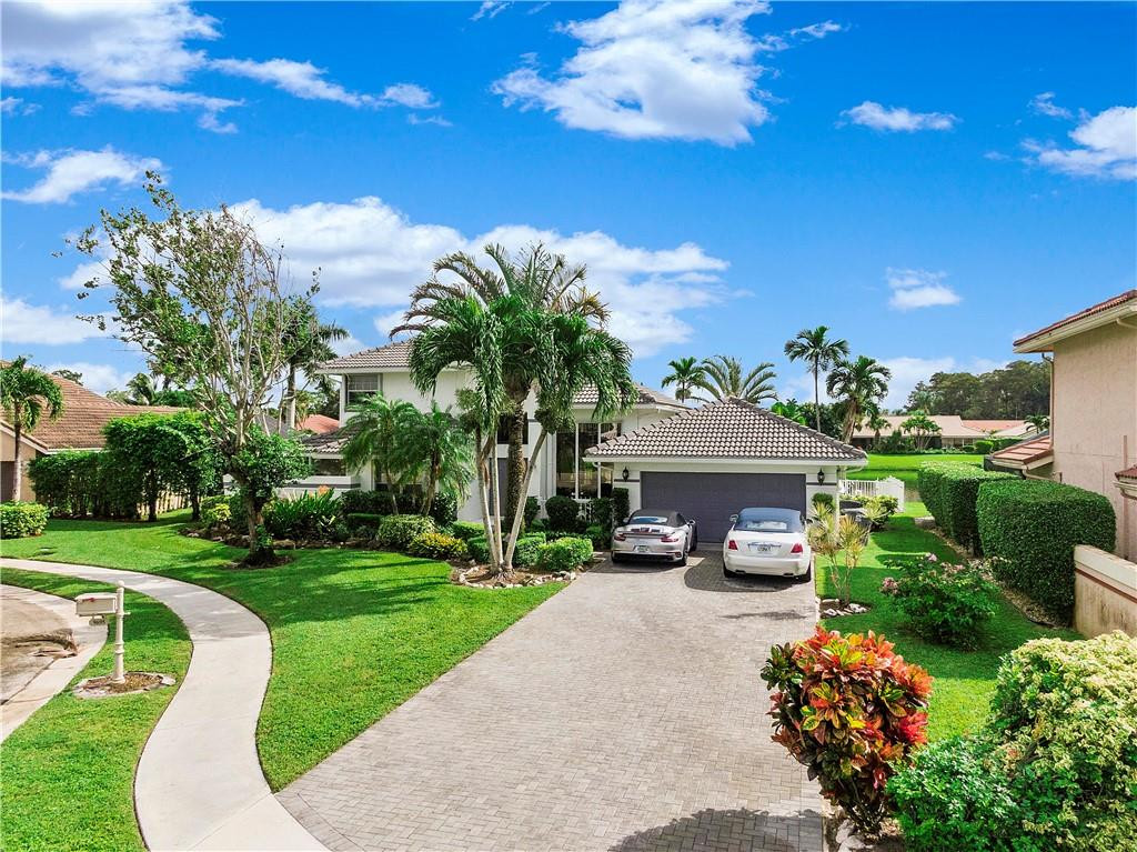 9695 West Lake Court Boca Raton, FL 33434 - Photo 3 of 43 a view of a house with a yard
