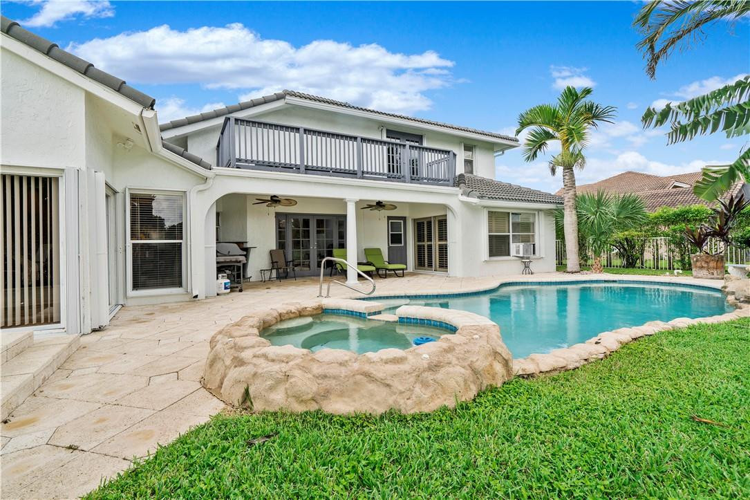 9695 West Lake Court Boca Raton, FL 33434 - Photo 32 of 43 a view of a house with a swimming pool