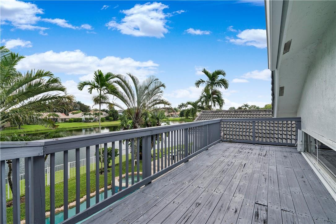 9695 West Lake Court Boca Raton, FL 33434 - Photo 34 of 43 a view of a balcony with wooden floor