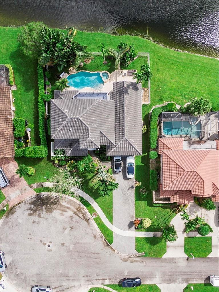 9695 West Lake Court Boca Raton, FL 33434 - Photo 40 of 43 an aerial view of a house with a garden and yard