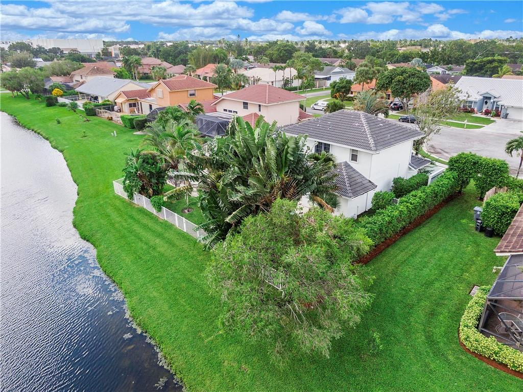 9695 West Lake Court Boca Raton, FL 33434 - Photo 41 of 43 an aerial view of residential houses with outdoor space and street view