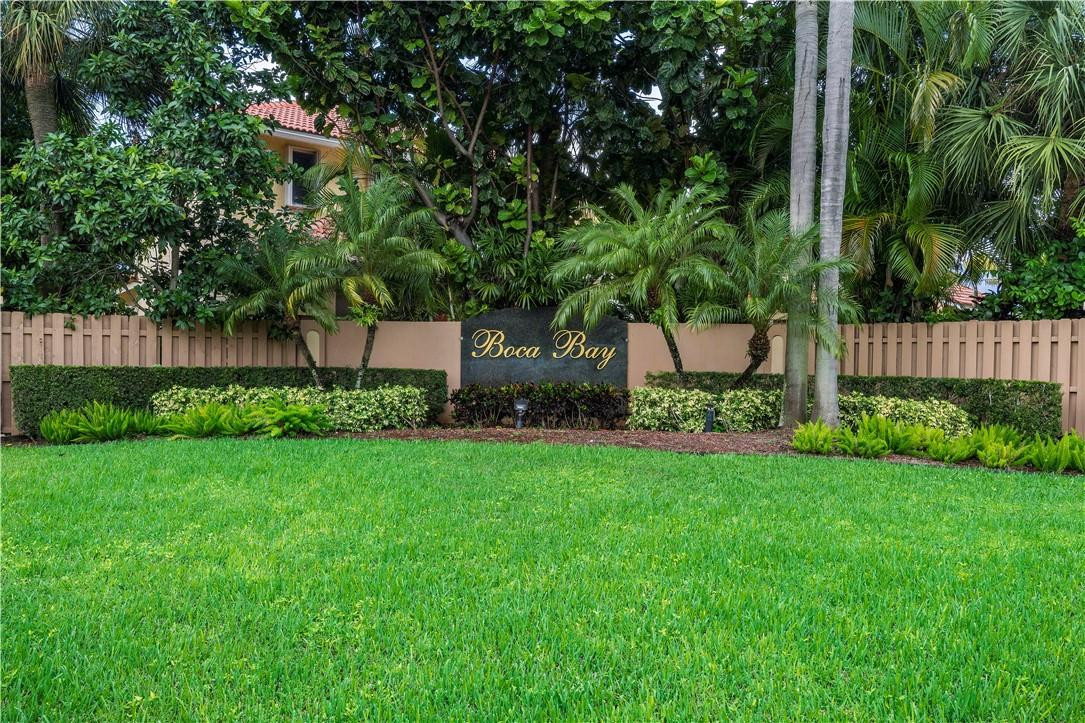 9695 West Lake Court Boca Raton, FL 33434 - Photo 43 of 43 a front view of a house with garden