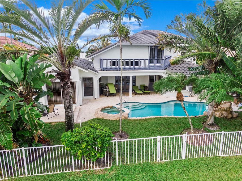 9695 West Lake Court Boca Raton, FL 33434 - Photo 5 of 43 a view of a house with a yard and plants