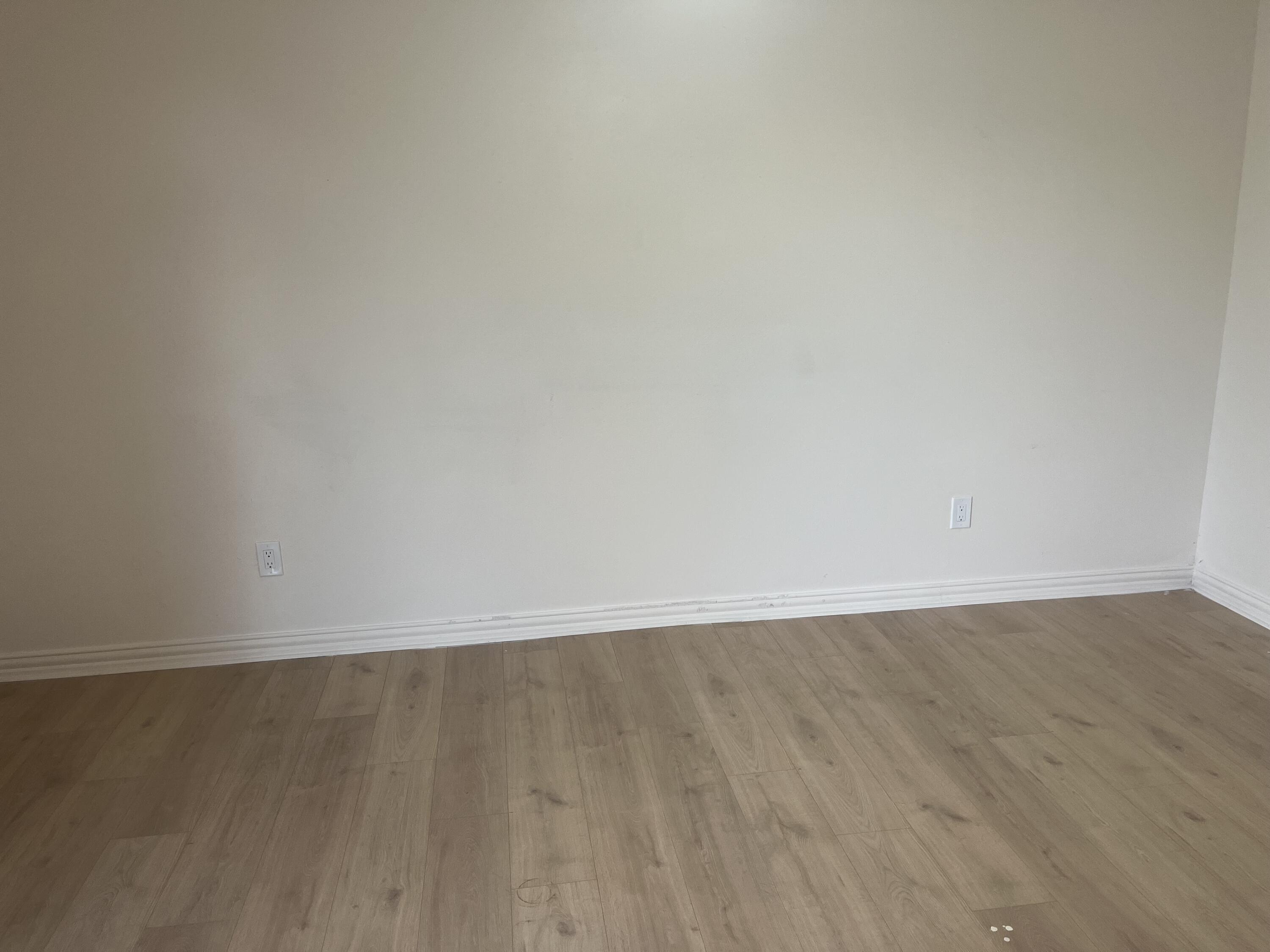 1906 70th Street Lubbock, TX 79412 - Photo 14 of 27 a view of an empty room with wooden floor