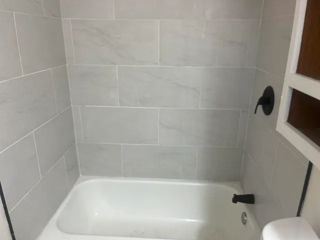 a close up of a bathtub in a bathroom