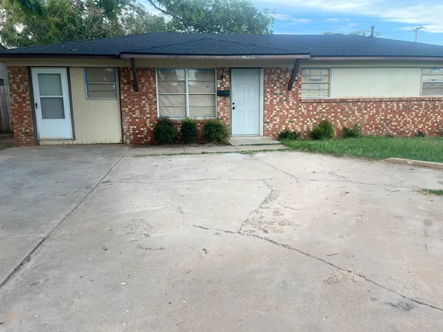 front view of a house with a garden
