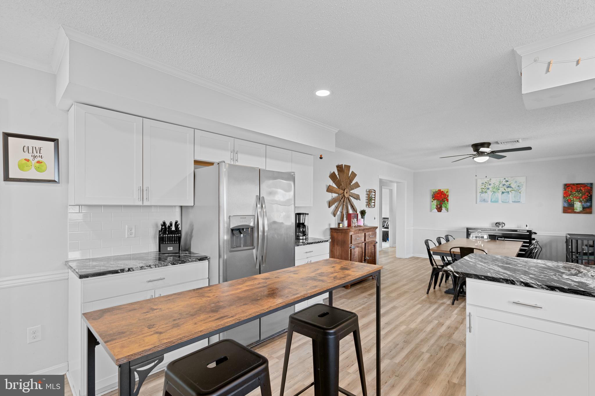 13171 Shiloh Church Road Laurel, DE 19956 - Photo 15 of 42 a kitchen with a table and chairs in it