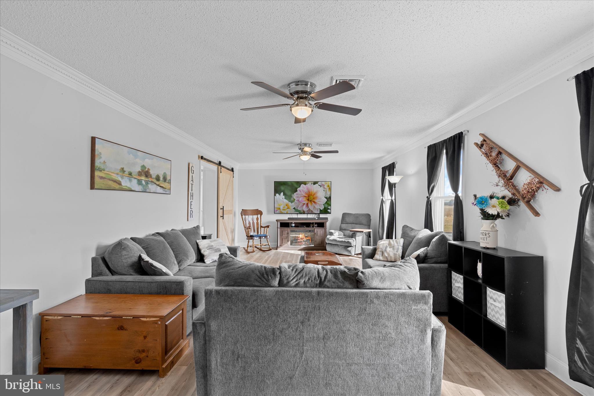 13171 Shiloh Church Road Laurel, DE 19956 - Photo 21 of 42 a living room with furniture and a chandelier