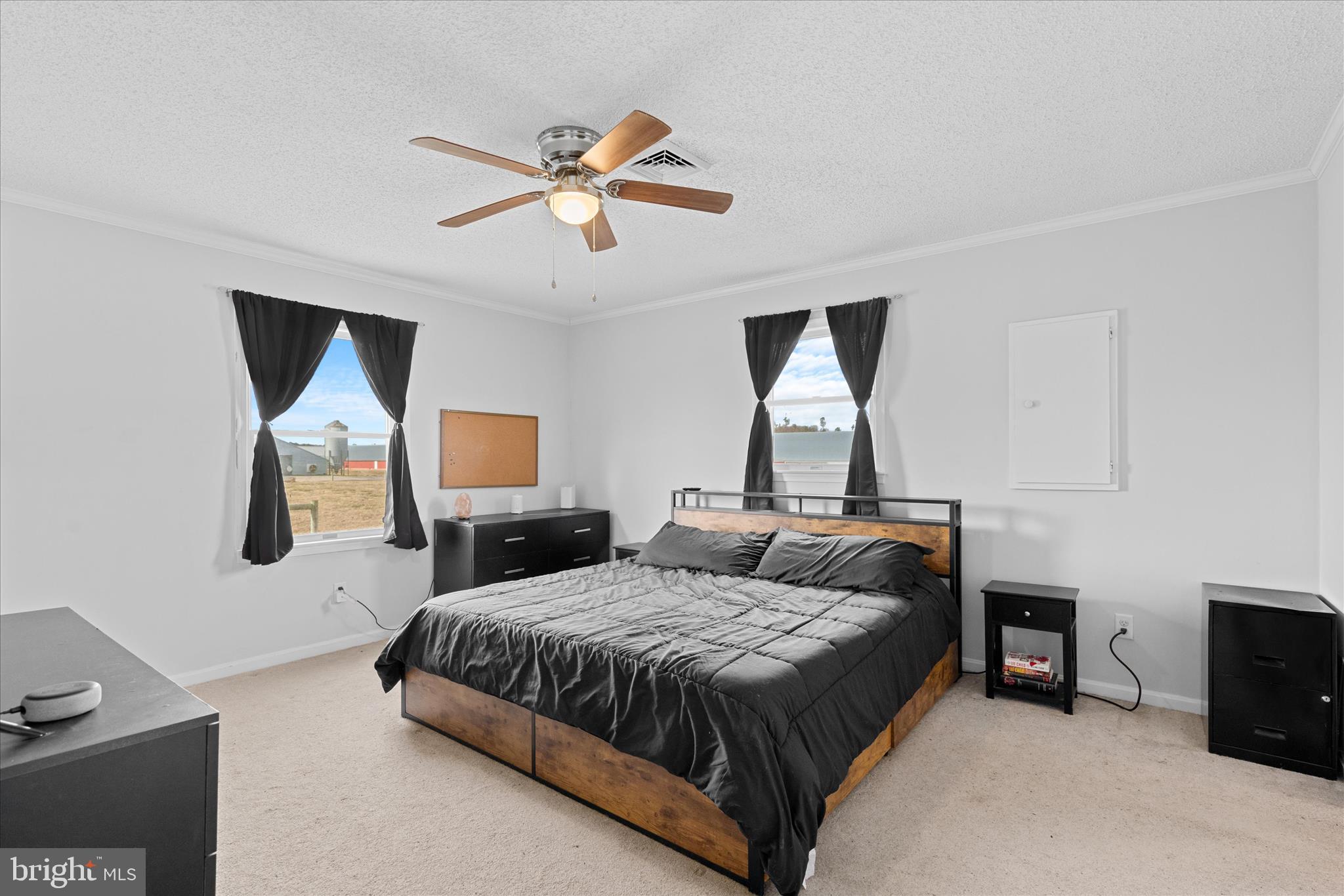 13171 Shiloh Church Road Laurel, DE 19956 - Photo 24 of 42 a bedroom with a bed and a chandelier