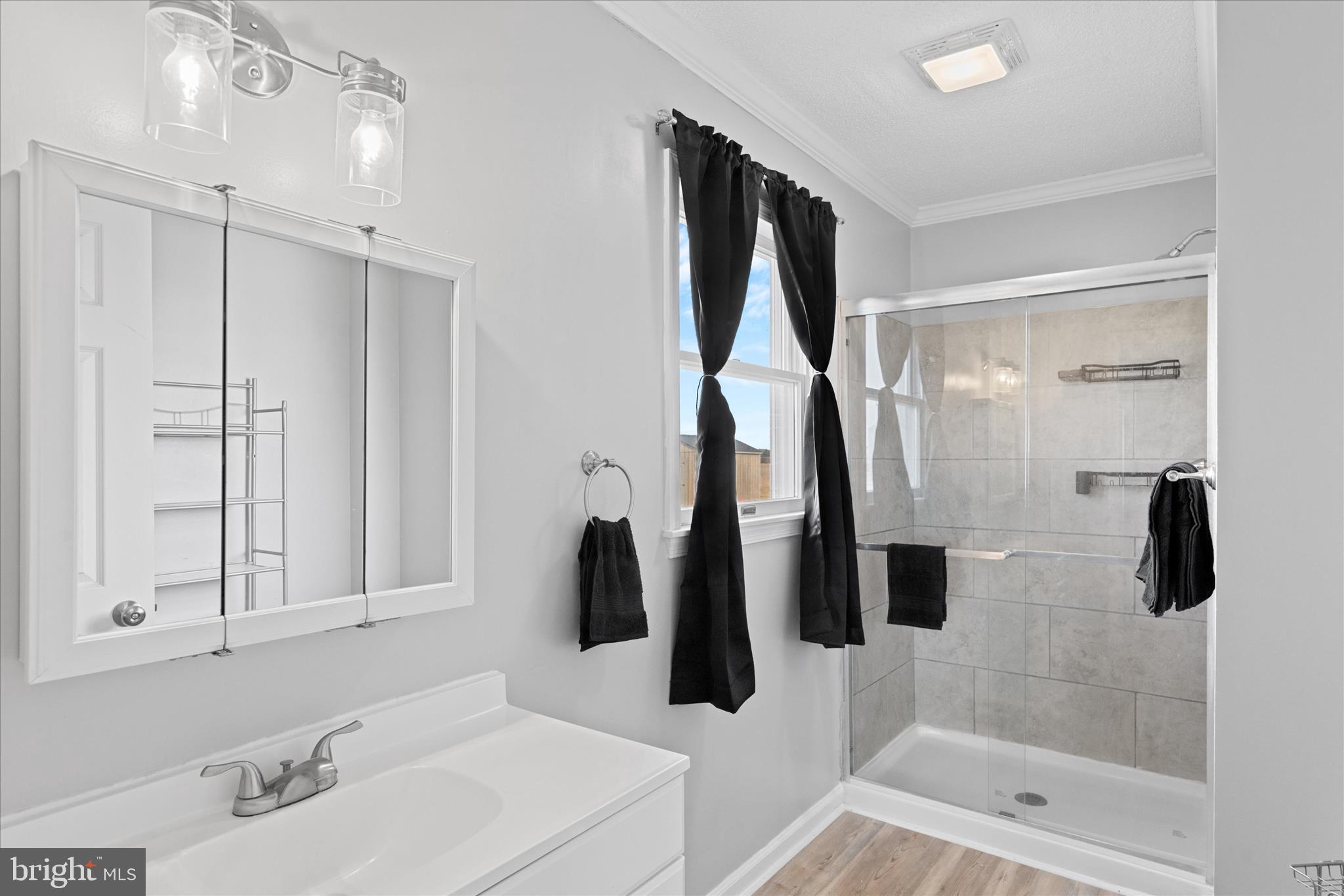 13171 Shiloh Church Road Laurel, DE 19956 - Photo 27 of 42 a bathroom with a tub sink and mirror