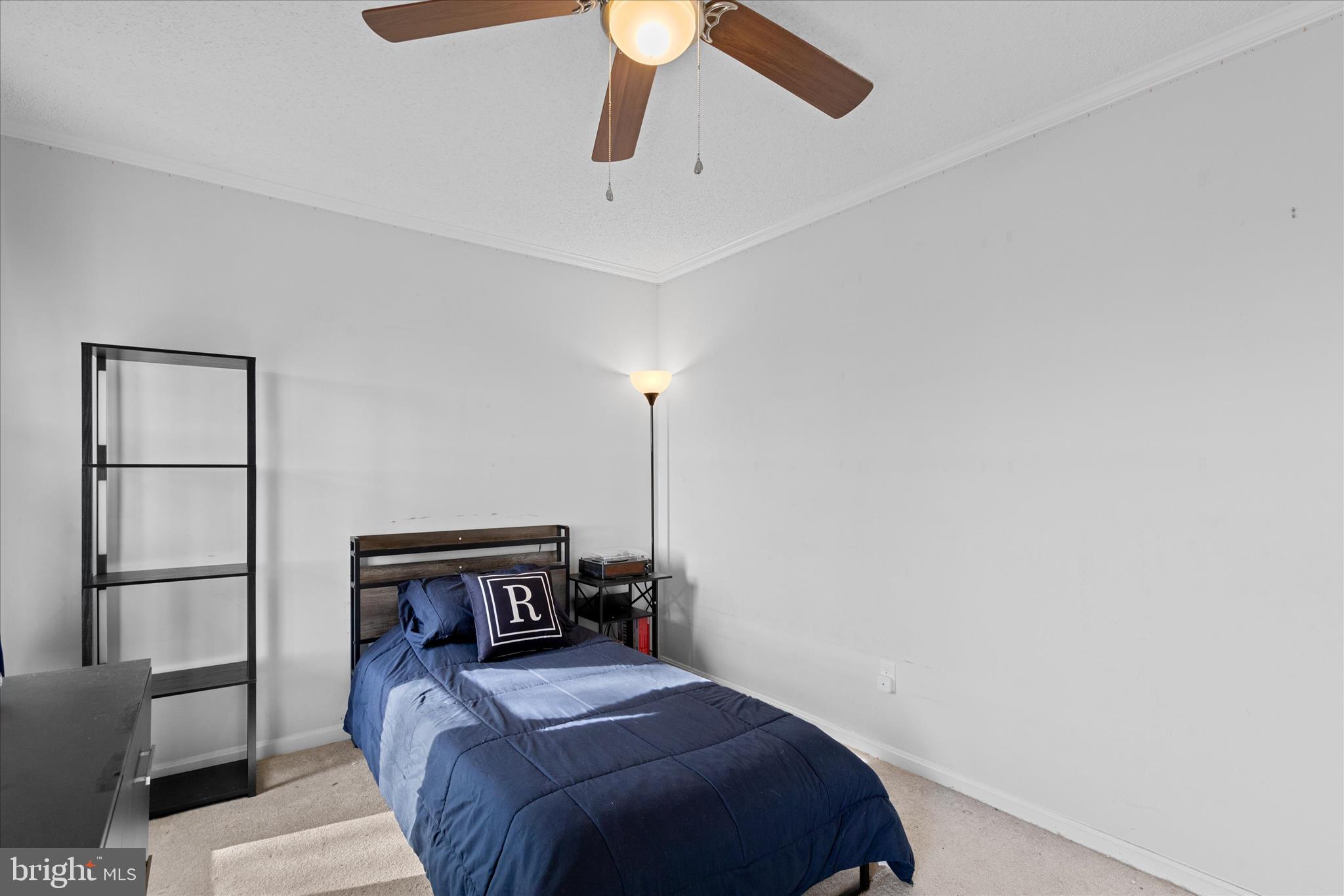 13171 Shiloh Church Road Laurel, DE 19956 - Photo 29 of 42 a bedroom with a bed and a chandelier