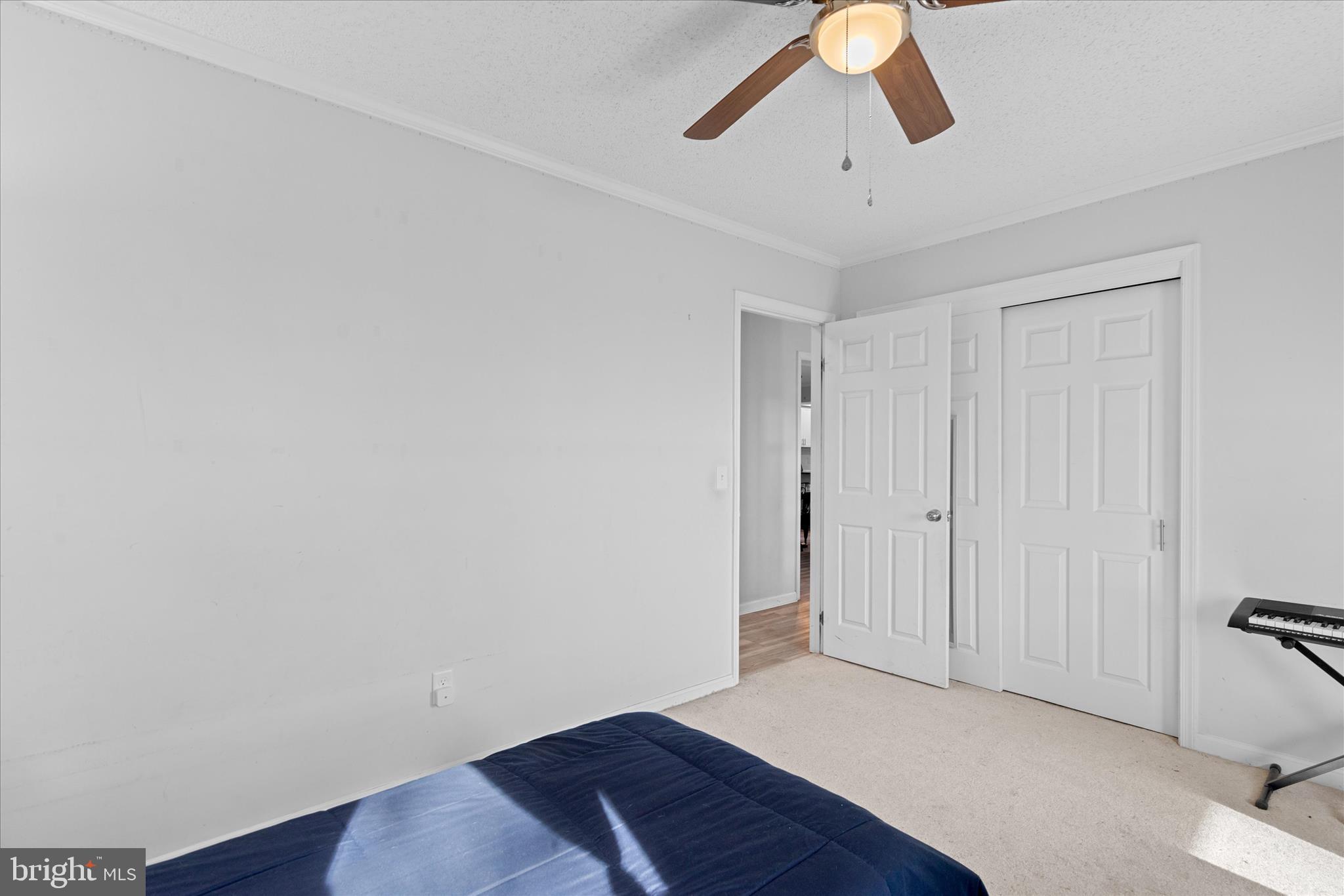 13171 Shiloh Church Road Laurel, DE 19956 - Photo 31 of 42 a view of room with a ceiling fan and wooden floor