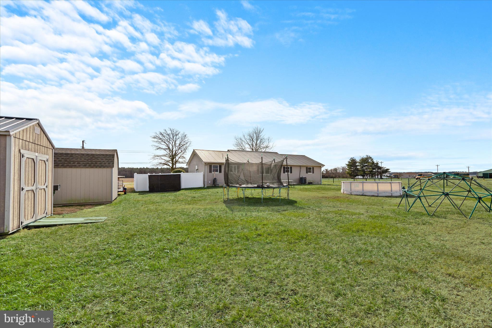 13171 Shiloh Church Road Laurel, DE 19956 - Photo 41 of 42 a backyard of a house with table and chairs