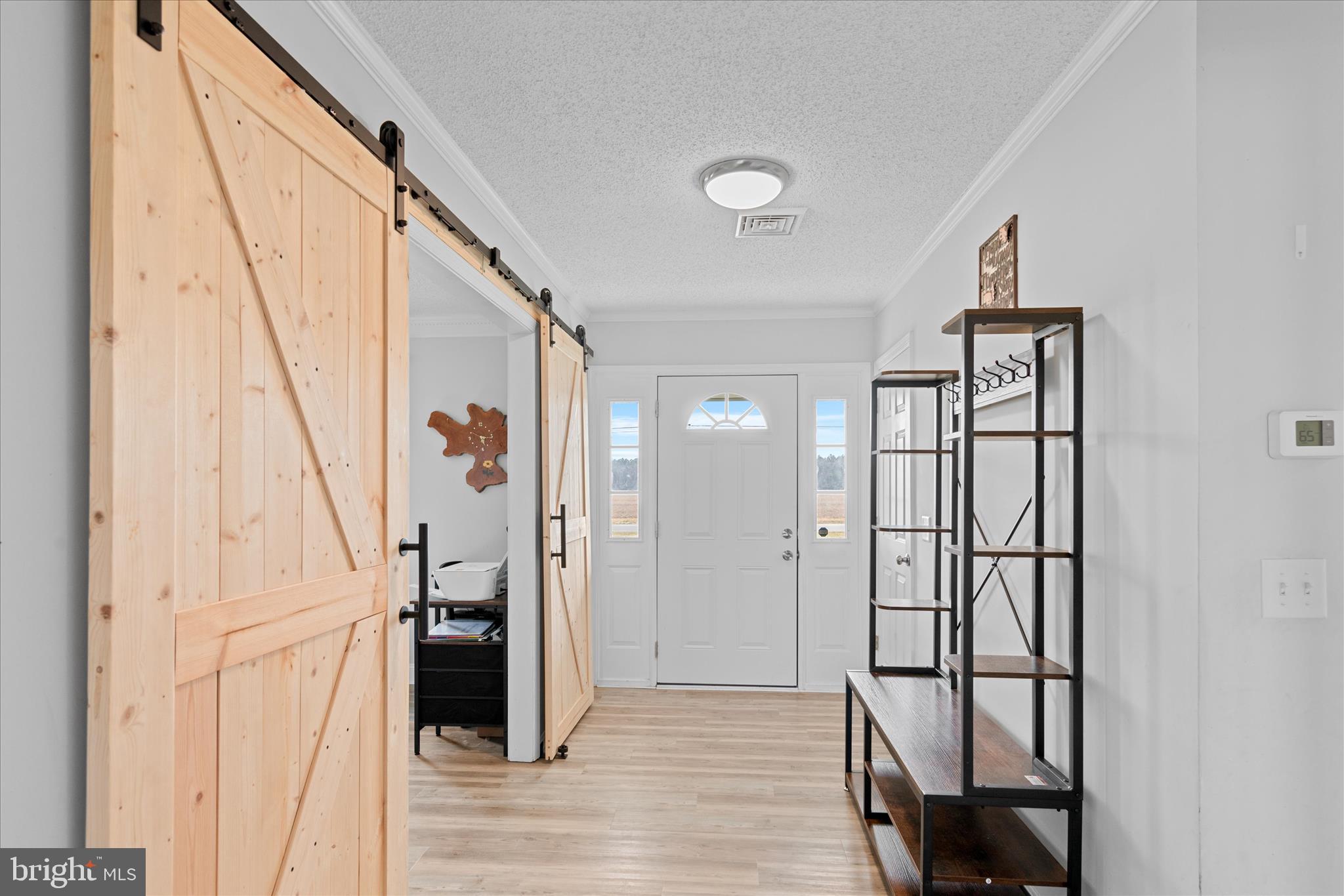 13171 Shiloh Church Road Laurel, DE 19956 - Photo 5 of 42 a view of hallway with stairs and wooden floor