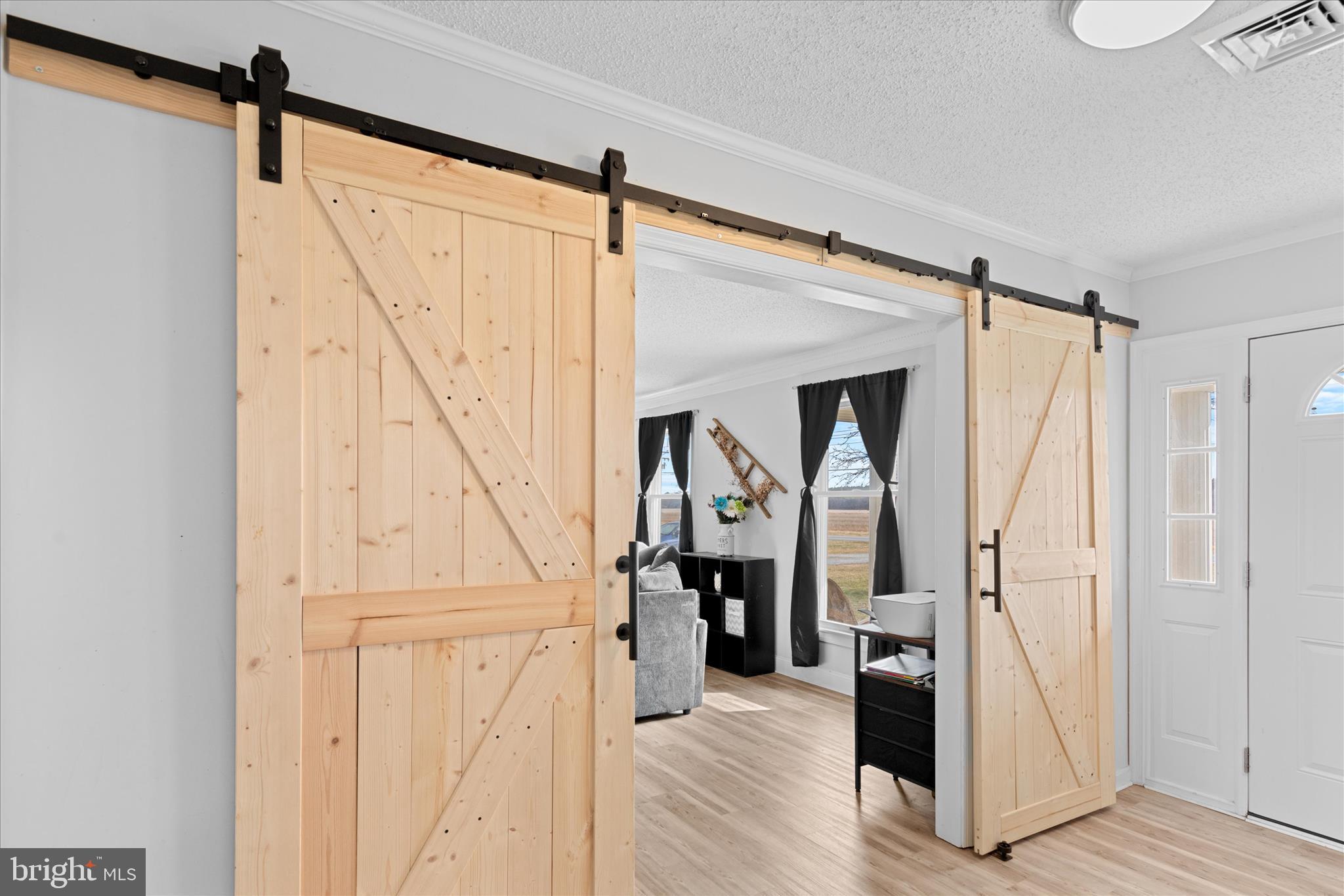 13171 Shiloh Church Road Laurel, DE 19956 - Photo 6 of 42 a view of front door with hallway and wooden floor