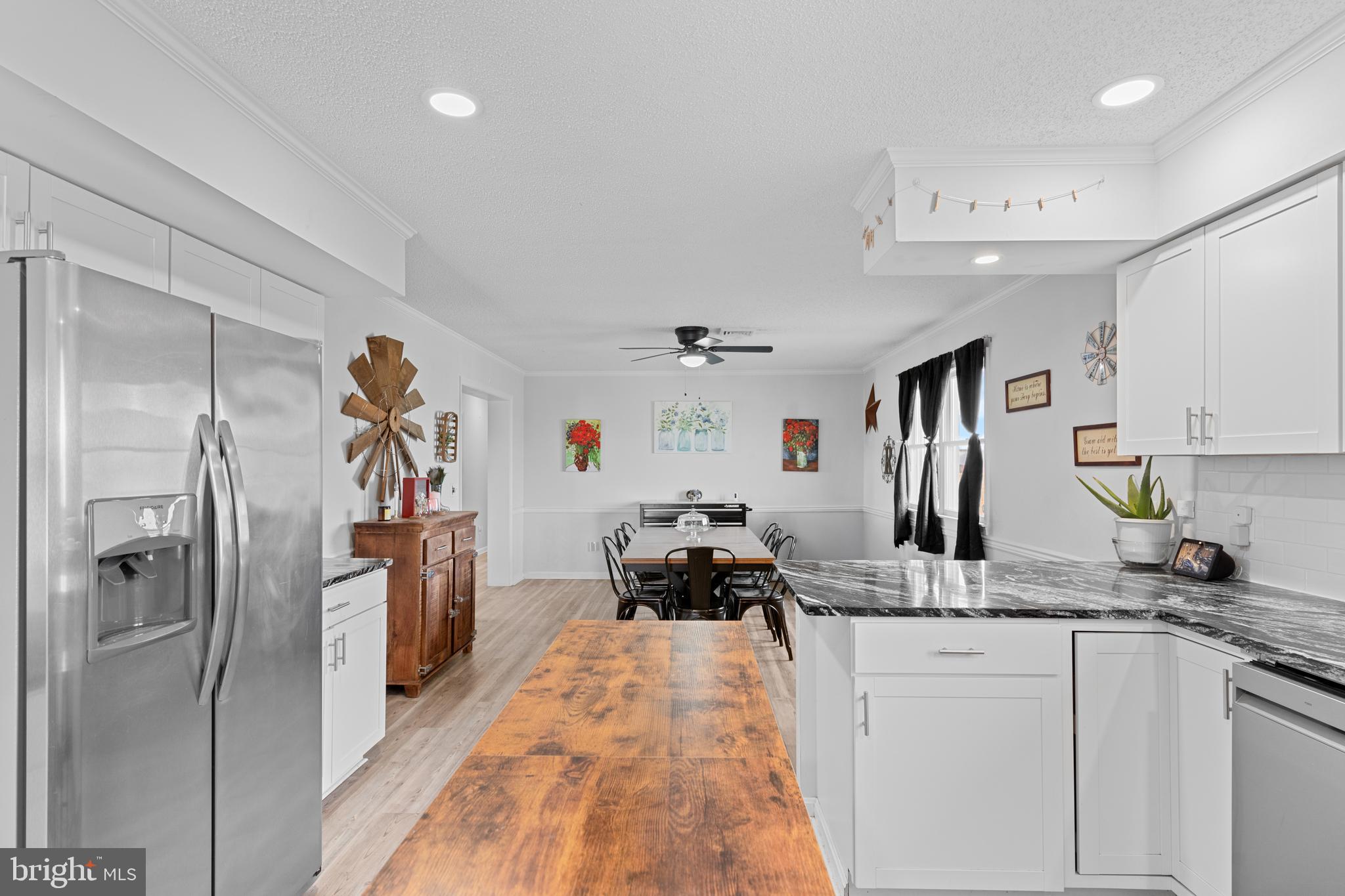 13171 Shiloh Church Road Laurel, DE 19956 - Photo 9 of 42 a very nice looking open kitchen with a refrigerator a sink a stove and cabinets