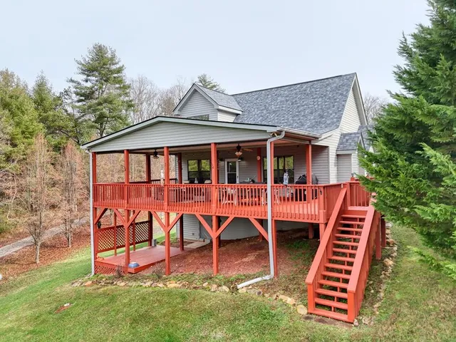 a view of a grassy field with trees