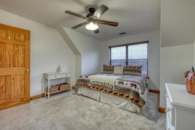 a view of a livingroom with furniture and a workspace