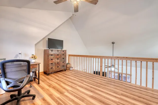 a bedroom with furniture and a window