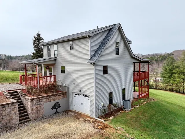 a backyard of a house with a tree