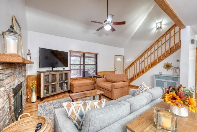 a spacious bedroom with a bed and a large window