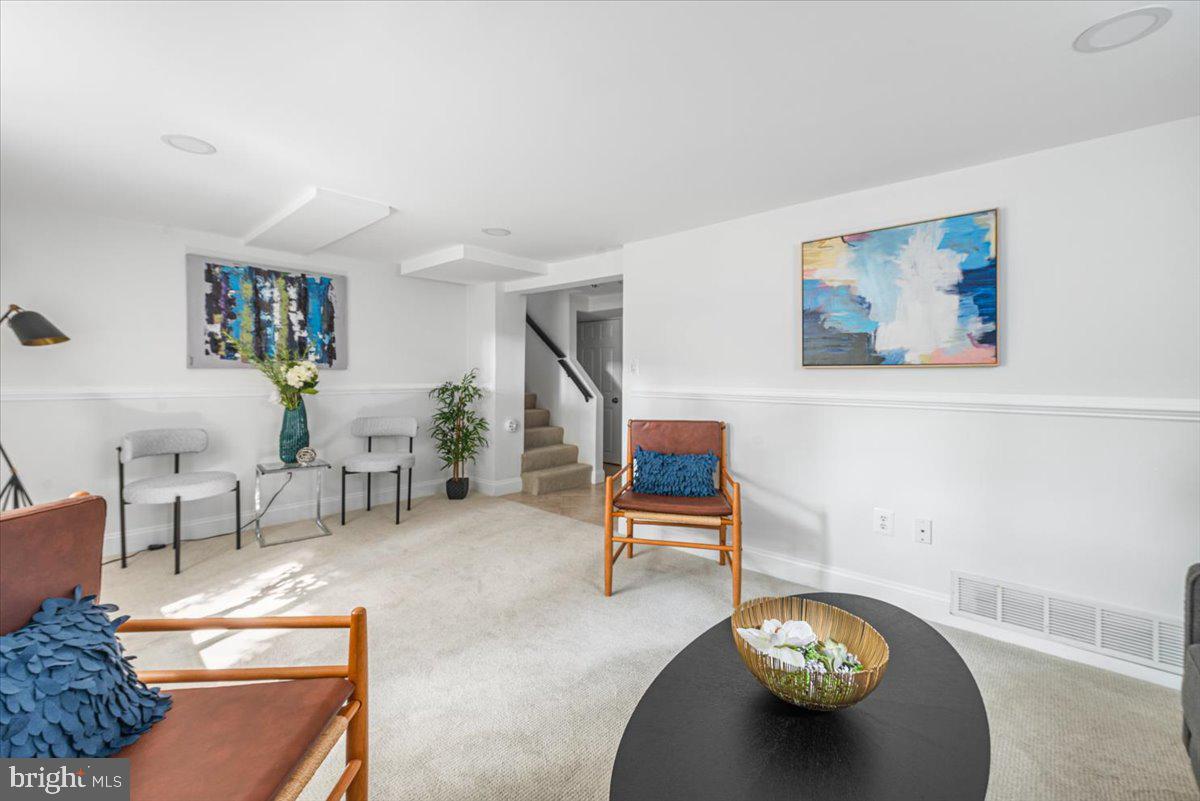 10112 Dallas Avenue Silver Spring, MD 20901 - Photo 20 of 32 a living room with furniture and a table