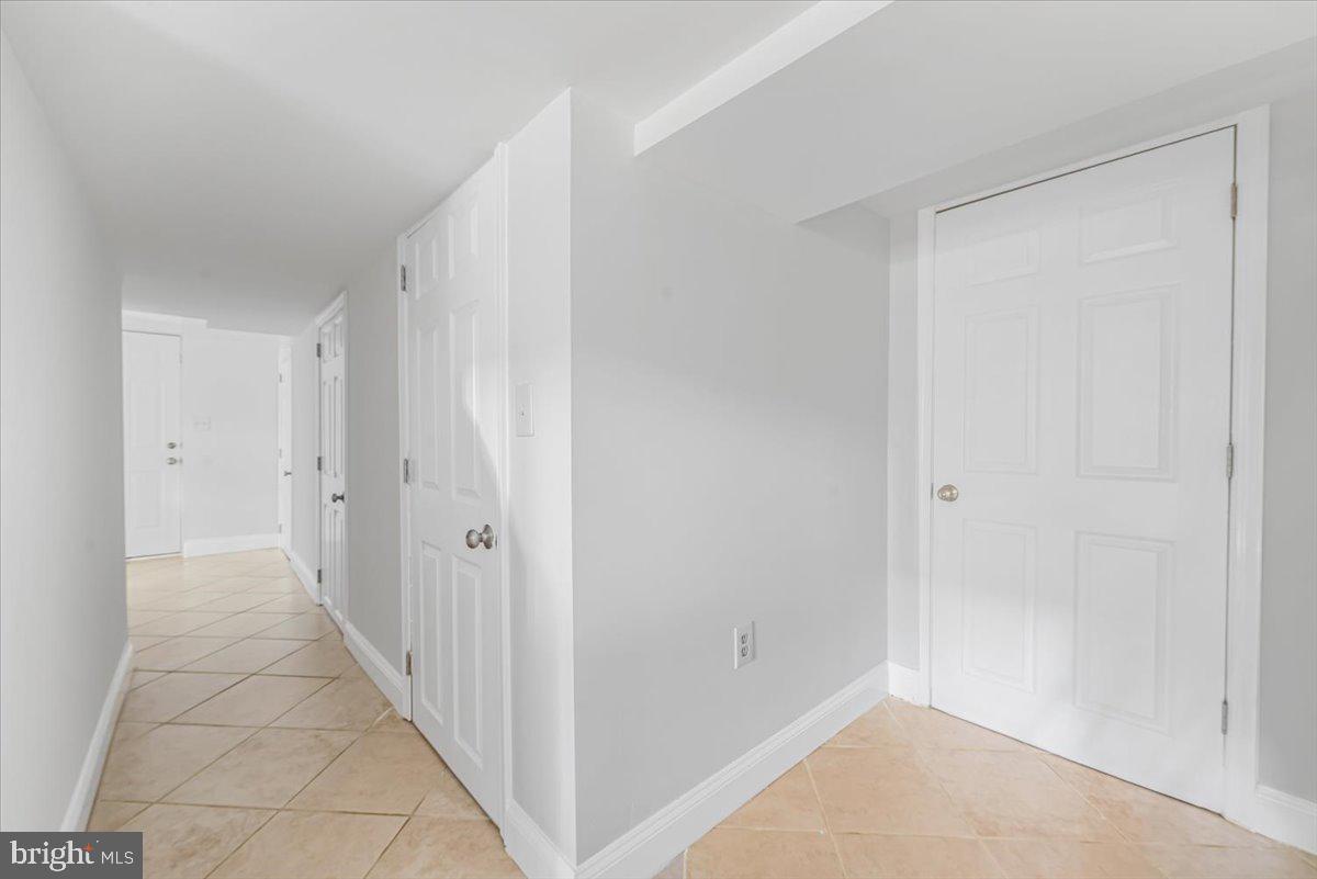 10112 Dallas Avenue Silver Spring, MD 20901 - Photo 21 of 32 a view of a hallway with white walls