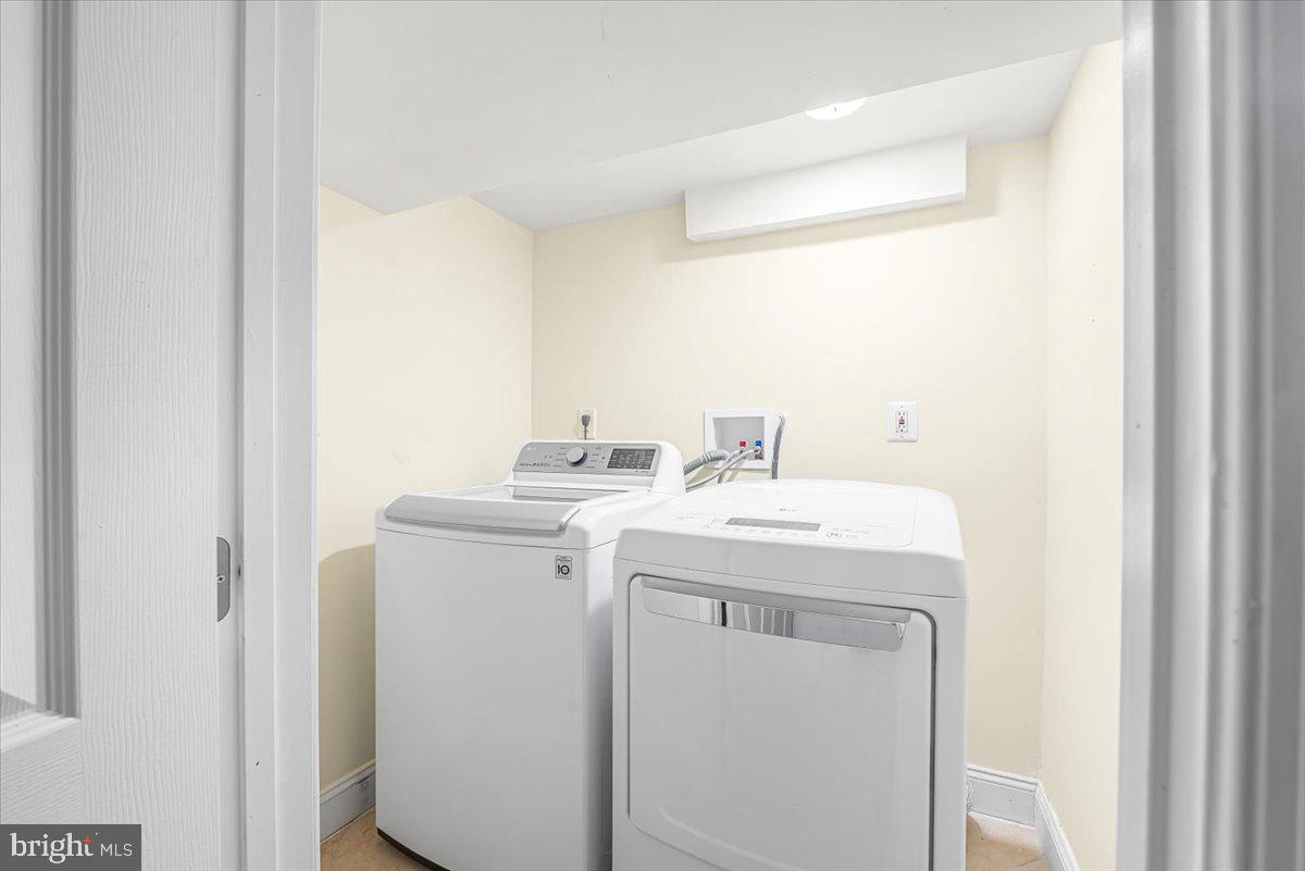 10112 Dallas Avenue Silver Spring, MD 20901 - Photo 22 of 32 a utility room with dryer and washer
