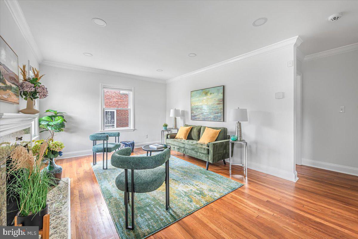 10112 Dallas Avenue Silver Spring, MD 20901 - Photo 3 of 32 a living room with furniture and a wooden floor