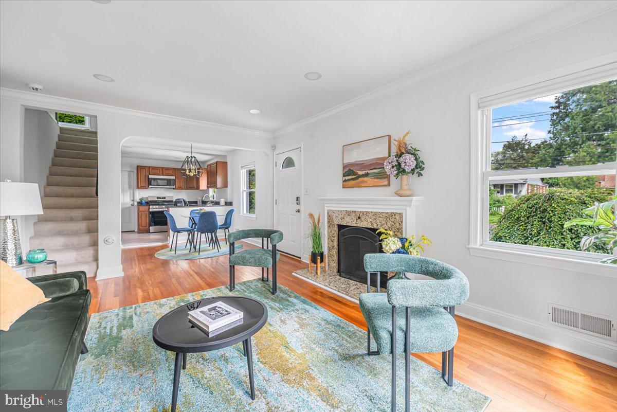 10112 Dallas Avenue Silver Spring, MD 20901 - Photo 5 of 32 a living room with furniture and a fireplace