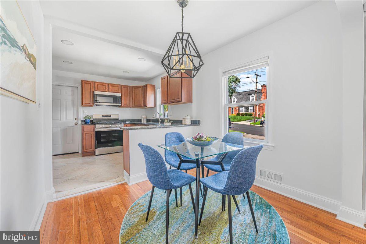 10112 Dallas Avenue Silver Spring, MD 20901 - Photo 6 of 32 a view of a dining room with furniture window and wooden floor