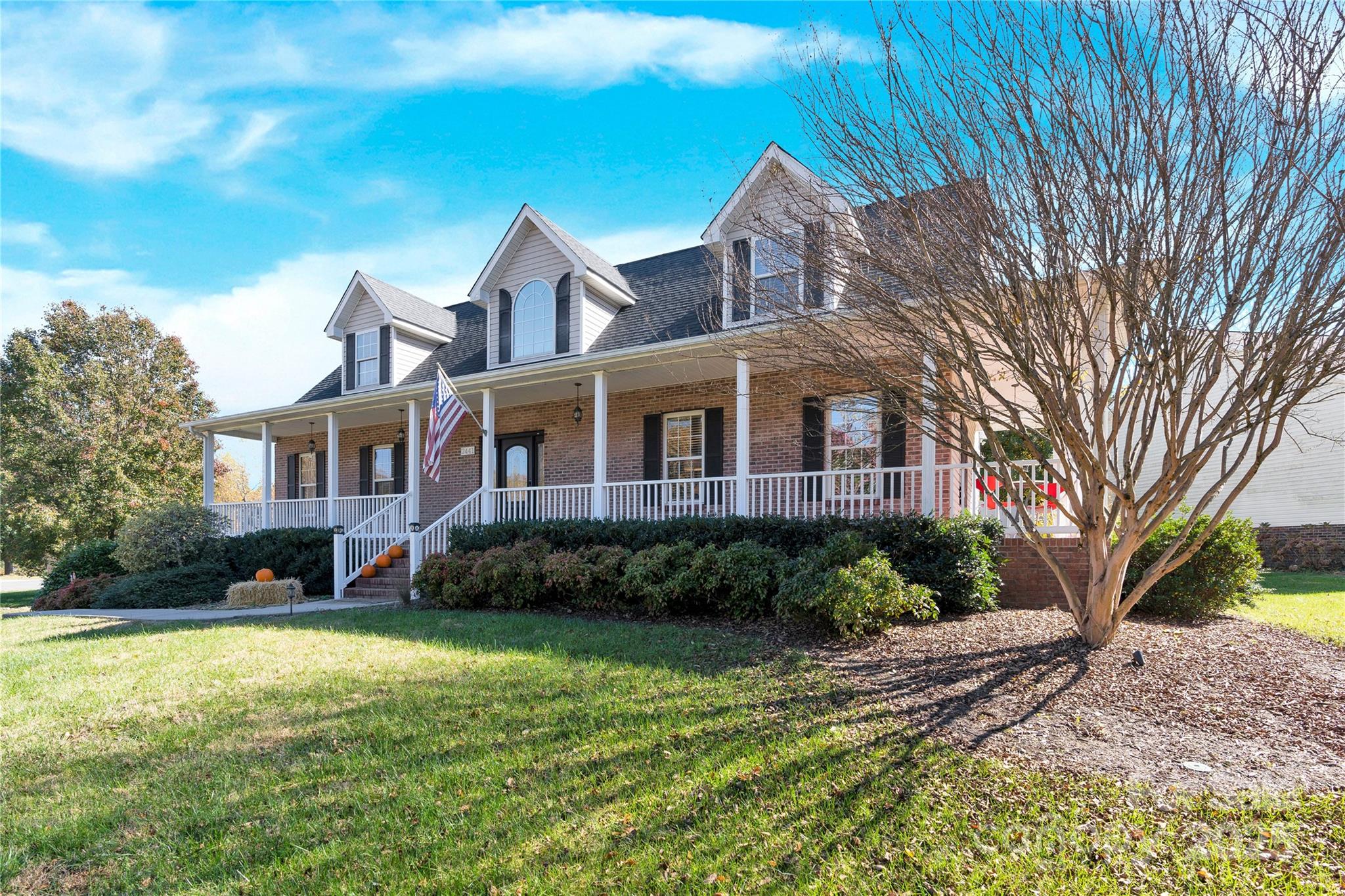 2441 27th Ave Circle Northeast Hickory, NC 28601 - Photo 1 of 45 a front view of a house with a yard and trees