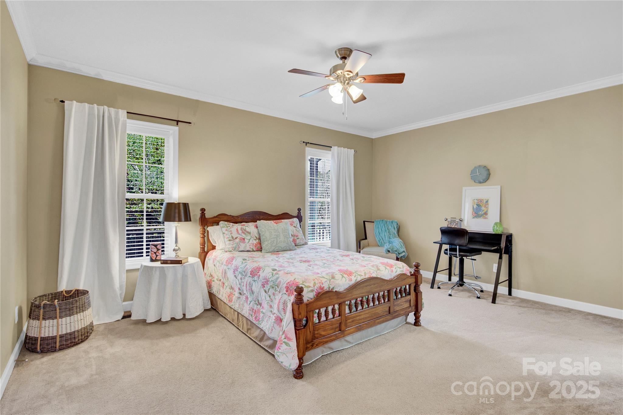 2441 27th Ave Circle Northeast Hickory, NC 28601 - Photo 12 of 45 a bedroom with a bed and a chandelier