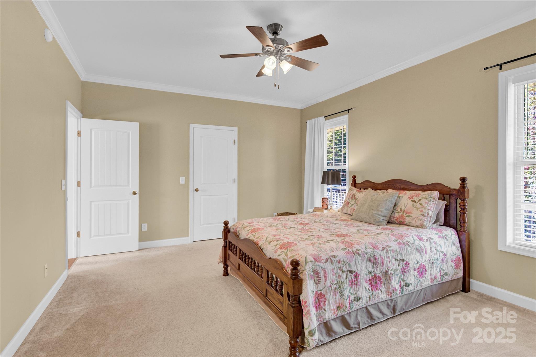 2441 27th Ave Circle Northeast Hickory, NC 28601 - Photo 13 of 45 a bedroom with a bed and a ceiling fan