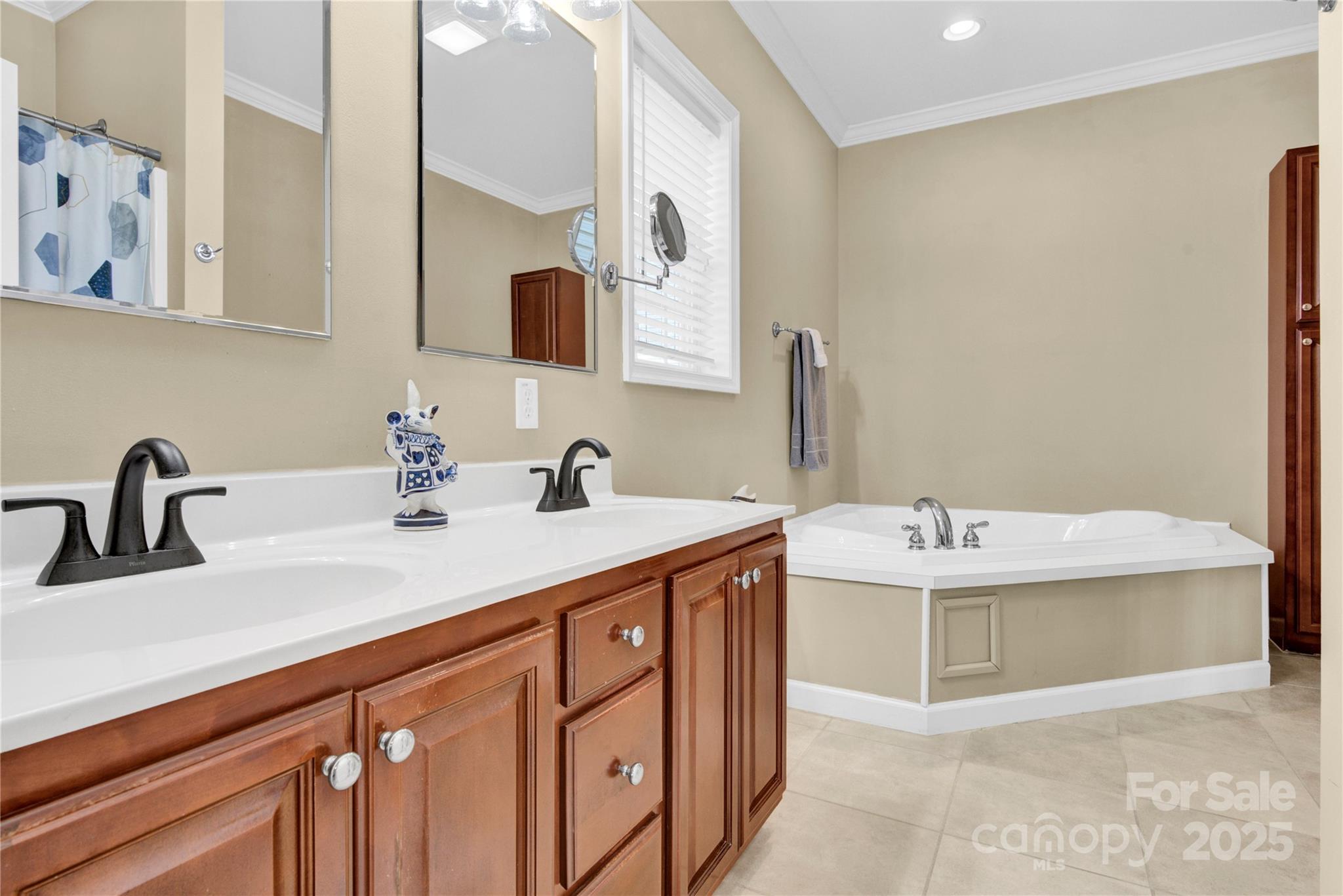 2441 27th Ave Circle Northeast Hickory, NC 28601 - Photo 15 of 45 a bathroom with a double vanity sink and a mirror