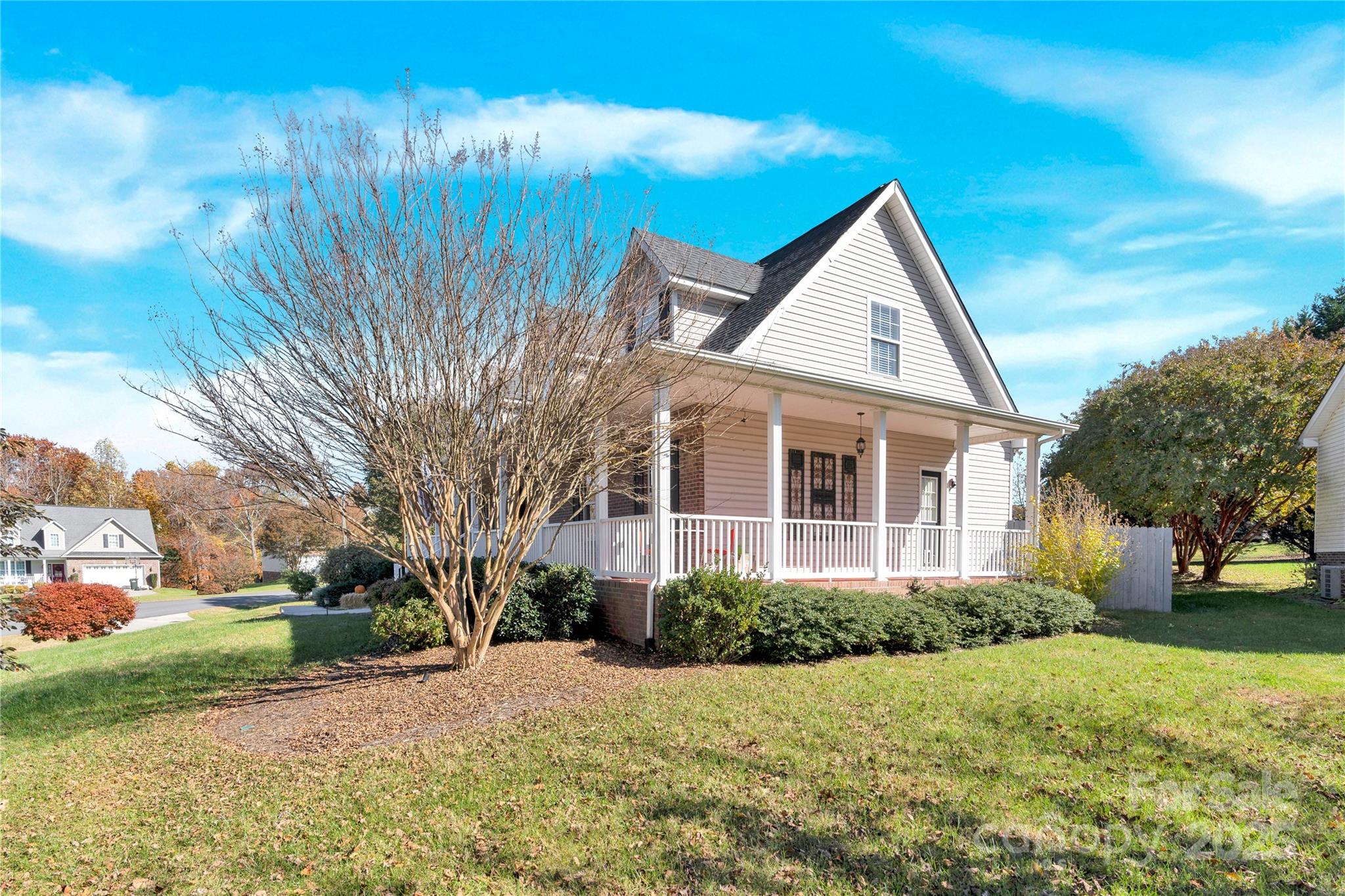 2441 27th Ave Circle Northeast Hickory, NC 28601 - Photo 3 of 45 a view of a house next to a yard with big trees