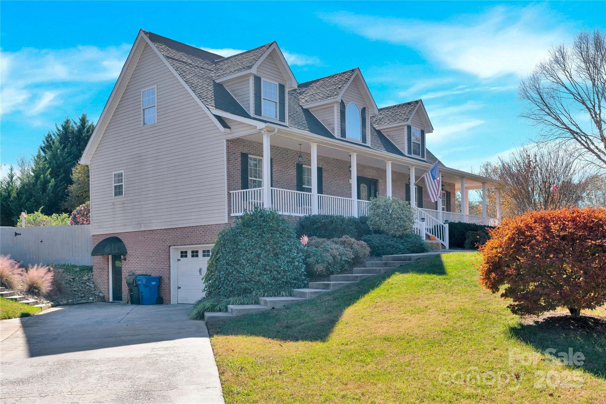2441 27th Ave Circle Northeast Hickory, NC 28601 - Photo 4 of 45 a front view of a house with a garden and plants