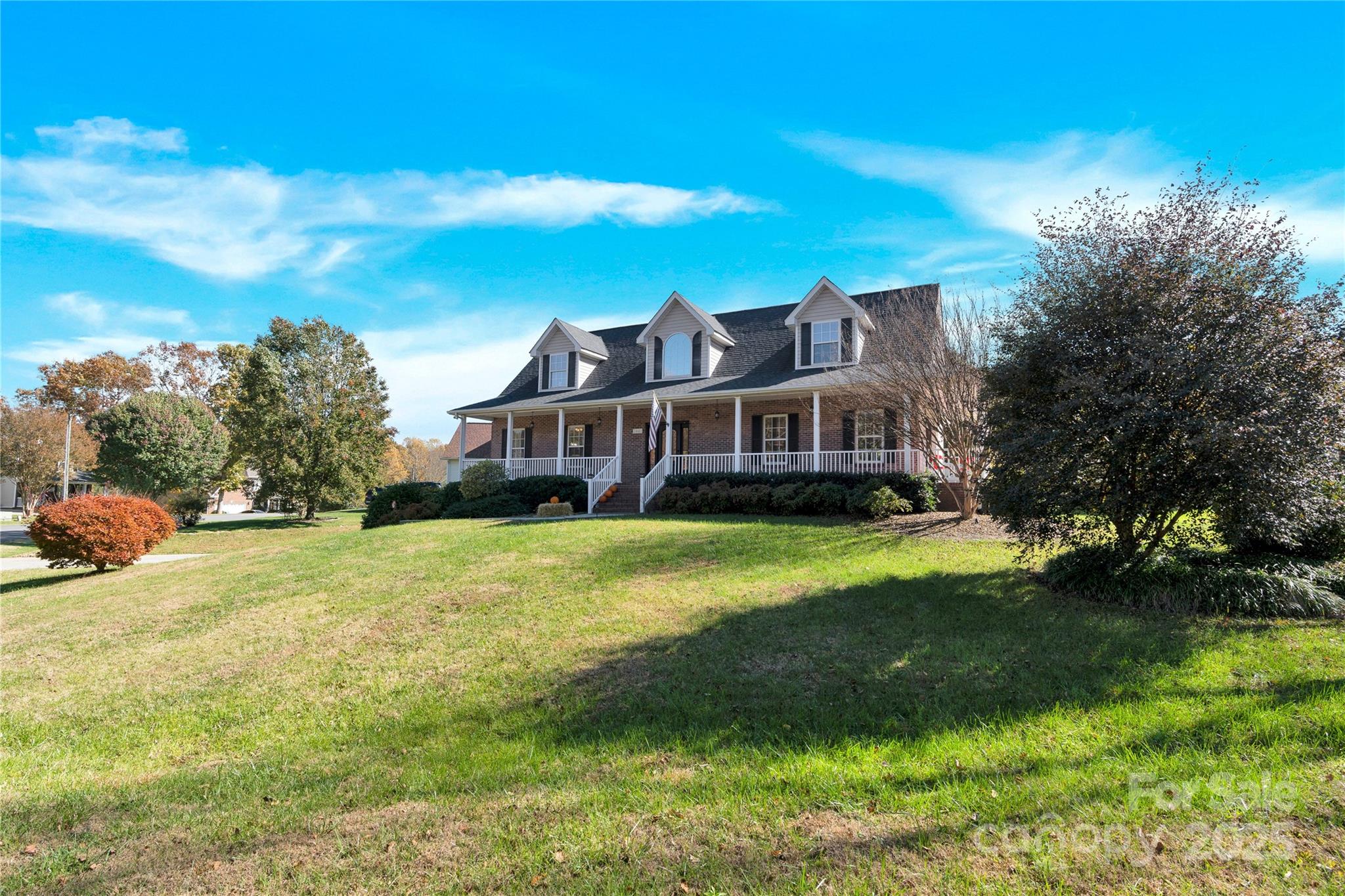 2441 27th Ave Circle Northeast Hickory, NC 28601 - Photo 5 of 45 a front view of a house with a yard table and chairs