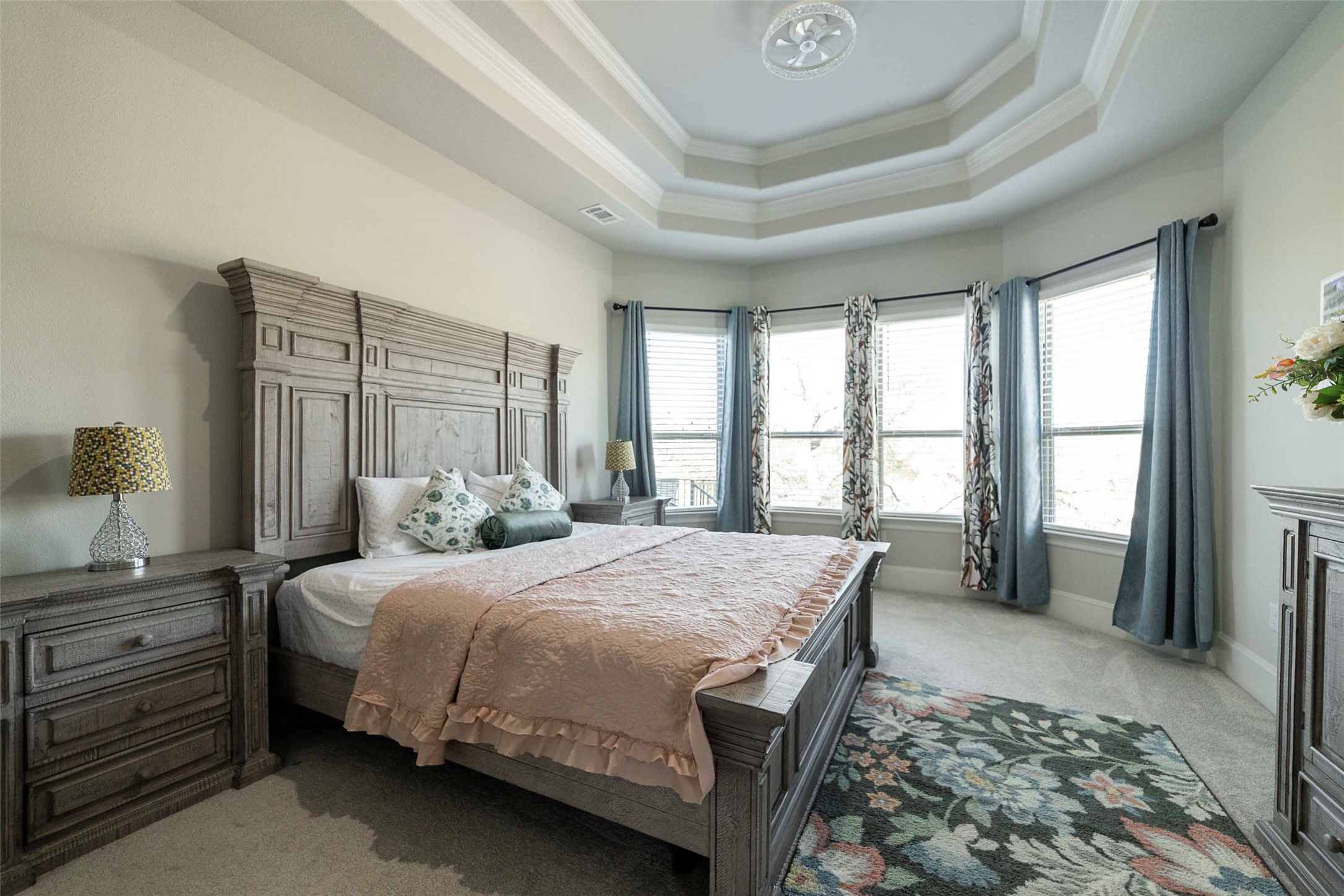 17821 Limestone Spring Lane Austin, TX 78738 - Photo 19 of 40 a bedroom with a bed and a dresser next to a window